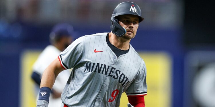 Trevor Larnach runs the bases