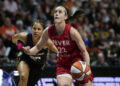 UNCASVILLE, CONNECTICUT - SEPTEMBER 25: Caitlin Clark #22 of the Indiana Fever drives against Veronica Burton #22 of the Connecticut Sun during the third quarter of Game Two of the 2024 WNBA Playoffs first round at Mohegan Sun Arena on September 25, 2024 in Uncasville, Connecticut. (Photo by Joe Buglewicz/Getty Images)