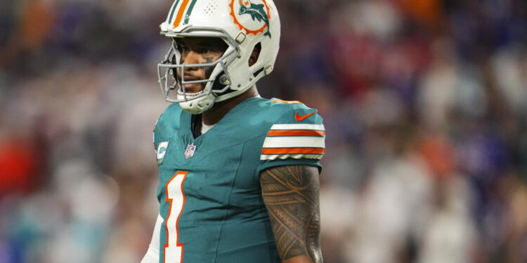 MIAMI GARDENS, FL - SEPTEMBER 12: Tua Tagovailoa #1 of the Miami Dolphins looks on from the field during an NFL football game against the Buffalo Bills at Hard Rock Stadium on September 12, 2024 in Miami Gardens, Florida. (Photo by Cooper Neill/Getty Images)