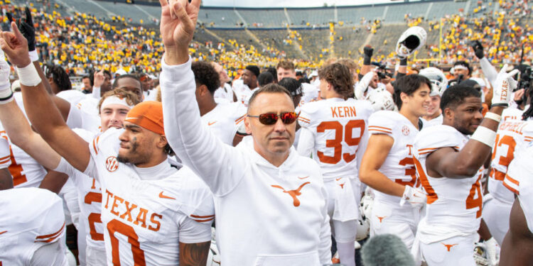 Texas coach Steve Sarkisian had plenty to celebrate about after the Longhorns trounced the Wolverines 31-12 on Saturday. (Aaron J. Thornton/Getty Images)