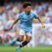 MANCHESTER, ENGLAND - SEPTEMBER 14: Rico Lewis of Manchester City during the Premier League match between Manchester City FC and Brentford FC at Etihad Stadium on September 14, 2024 in Manchester, England. (Photo by James Gill - Danehouse/Getty Images)