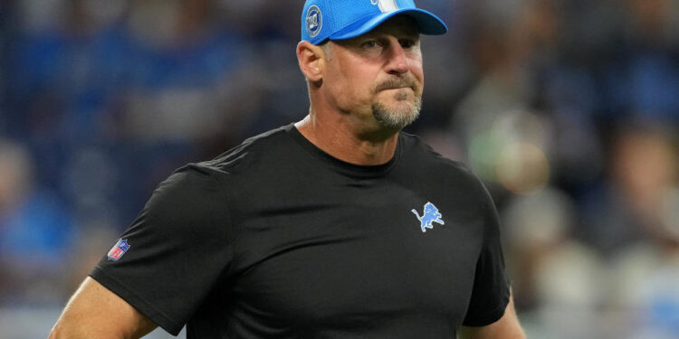 DETROIT, MICHIGAN - SEPTEMBER 08: Head coach Dan Campbell looks on during warmups prior to their game against the Los Angeles Rams at Ford Field on September 08, 2024 in Detroit, Michigan. (Photo by Nic Antaya/Getty Images)