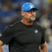 DETROIT, MICHIGAN - SEPTEMBER 08: Head coach Dan Campbell looks on during warmups prior to their game against the Los Angeles Rams at Ford Field on September 08, 2024 in Detroit, Michigan. (Photo by Nic Antaya/Getty Images)