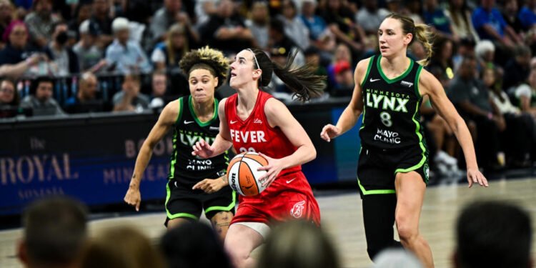 MINNEAPOLIS, MINNESOTA - AUGUST 24: Caitlin Clark #22 of the Indiana Fever drives with the ball in the second quarter of the game against the Minnesota Lynx at Target Center on August 24, 2024 in Minneapolis, Minnesota. NOTE TO USER: User expressly acknowledges and agrees that, by downloading and or using this photograph, User is consenting to the terms and conditions of the Getty Images License Agreement. (Photo by Stephen Maturen/Getty Images)