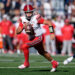 Sep 14, 2024; Logan, Utah, USA;  Utah Utes quarterback Isaac Wilson (11) runs with the ball against the Utah State Aggies at Merlin Olsen Field at Maverik Stadium. Mandatory Credit: Jamie Sabau-Imagn Images