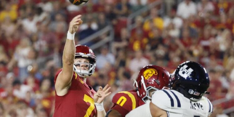 Los Angeles, CA - September 07: USC starting quarterback Miller Moss, #7, left.