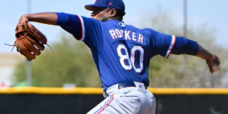 SURPRISE, ARIZONA - MARCH 25, 2023: Kumar Rocker #80 of the Texas Rangers throws a pitch during a minor league spring training game against the Kansas City Royals at Surprise Stadium on March 25, 2023 in Surprise, Arizona. (Photo by David Durochik/Diamond Images via Getty Images)