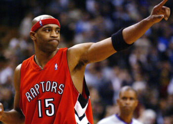 TORONTO - NOVEMBER 3:   Vince Carter #15 of the Toronto Raptors salutes the crowd after beating the Houston Rockets 95-88 during a game at the Air Canada Centre on November 3, 2003 in Toronto, Canada.  NOTE TO USER: User expressly acknowledges and agrees that, by downloading and or using this photograph, User is consenting to the terms and conditions of the Getty Images License Agreement. (Photo by Dave Sandford/Getty Images)