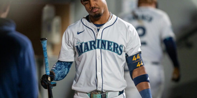 SEATTLE, WA - SEPTEMBER 18: Julio Rodriguez #44 of the Seattle Mariners reacts in the dugout after striking out during the fifth inning of a game against the New York Yankees at T-Mobile Park on September 18, 2024 in Seattle, Washington. (Photo by Stephen Brashear/Getty Images)