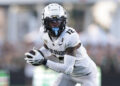 FORT COLLINS, COLORADO - SEPTEMBER 14: Travis Hunter #12 of the Colorado Buffaloes runs with the ball during the second quarter against the Colorado State Rams at Canvas Stadium on September 14, 2024 in Fort Collins, Colorado. (Photo by Andrew Wevers/Getty Images)