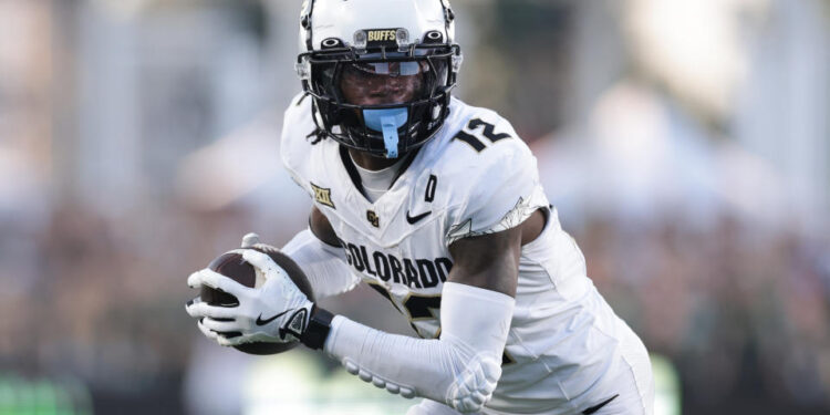 FORT COLLINS, COLORADO - SEPTEMBER 14: Travis Hunter #12 of the Colorado Buffaloes runs with the ball during the second quarter against the Colorado State Rams at Canvas Stadium on September 14, 2024 in Fort Collins, Colorado. (Photo by Andrew Wevers/Getty Images)