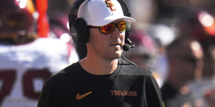 Southern California head coach Lincoln Riley watches against Michigan in the first half.