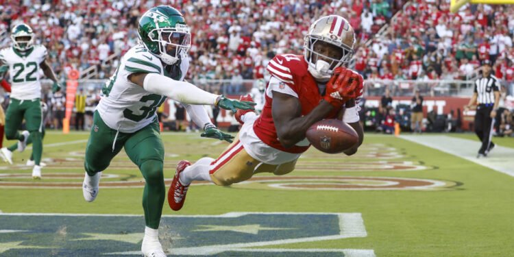 SANTA CLARA, CALIFORNIA - SEPTEMBER 09: Wide receiver Brandon Aiyuk #11 of the San Francisco 49ers drops a catch in the end zone against cornerback Michael Carter II #30 of the New York Jets during the second quarter at Levi's Stadium on September 09, 2024 in Santa Clara, California. (Photo by Lachlan Cunningham/Getty Images)