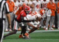 ATLANTA, GA - AUGUST 31: Georgia Bulldogs defensive back Daniel Harris (7) tackles Clemson Tigers wide receiver Bryant Wesco Jr. (12) during the AFLAC Kickoff Game between the Clemson Tigers and the Georgia Bulldogs on August 31, 2024, at Mercedes-Benz Stadium in Atlanta, Ga. (Photo by Jeffrey Vest/Icon Sportswire via Getty Images)