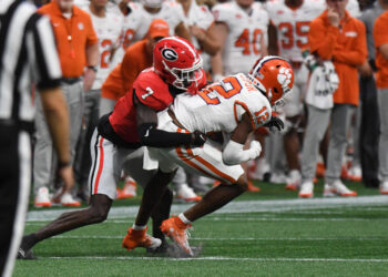 ATLANTA, GA - AUGUST 31: Georgia Bulldogs defensive back Daniel Harris (7) tackles Clemson Tigers wide receiver Bryant Wesco Jr. (12) during the AFLAC Kickoff Game between the Clemson Tigers and the Georgia Bulldogs on August 31, 2024, at Mercedes-Benz Stadium in Atlanta, Ga. (Photo by Jeffrey Vest/Icon Sportswire via Getty Images)