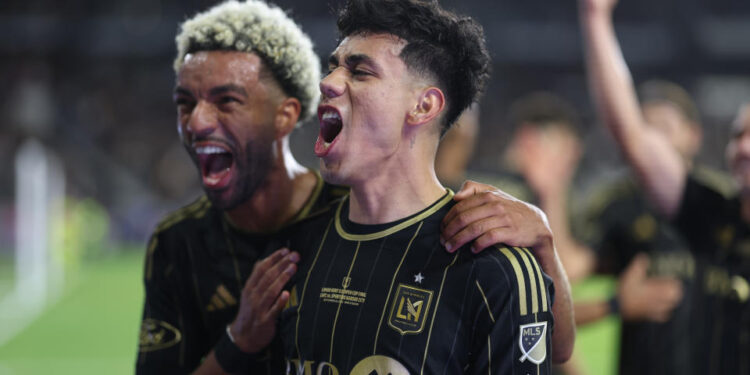 LOS ANGELES, CALIFORNIA - SEPTEMBER 25: Omar Campos #2 of Los Angeles FC celebrates his goal with Timothy Tillman #11 during extra time of the finals against Sporting Kansas City during the 2024 Lamar Hunt U. S. Open Cup at BMO Stadium on September 25, 2024 in Los Angeles, California.  (Photo by Michael Owens/USSF/Getty Images for USSF)