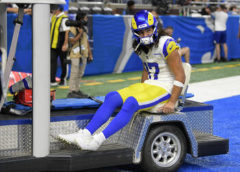 Sep 8, 2024; Detroit, Michigan, USA; Los Angeles Rams wide receiver Puka Nacua (17) is carted off the field after being injured against the Detroit Lions in the first half at Ford Field. Mandatory Credit: Lon Horwedel-Imagn Images