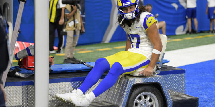 Sep 8, 2024; Detroit, Michigan, USA; Los Angeles Rams wide receiver Puka Nacua (17) is carted off the field after being injured against the Detroit Lions in the first half at Ford Field. Mandatory Credit: Lon Horwedel-Imagn Images