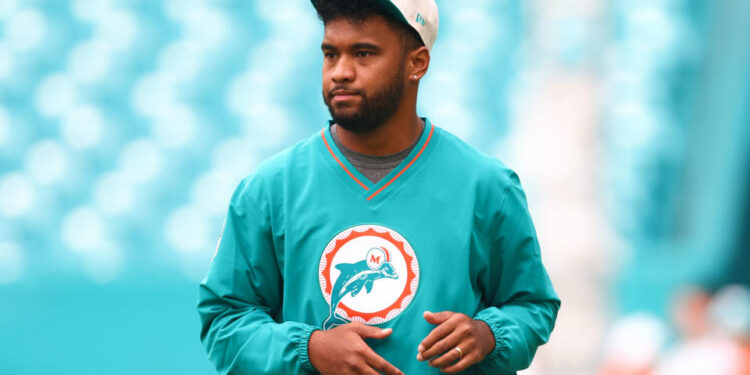 MIAMI GARDENS, FLORIDA - SEPTEMBER 12: Tua Tagovailoa #1 of the Miami Dolphins warms up prior to a game against the Buffalo Bills at Hard Rock Stadium on September 12, 2024 in Miami Gardens, Florida. (Photo by Megan Briggs/Getty Images)