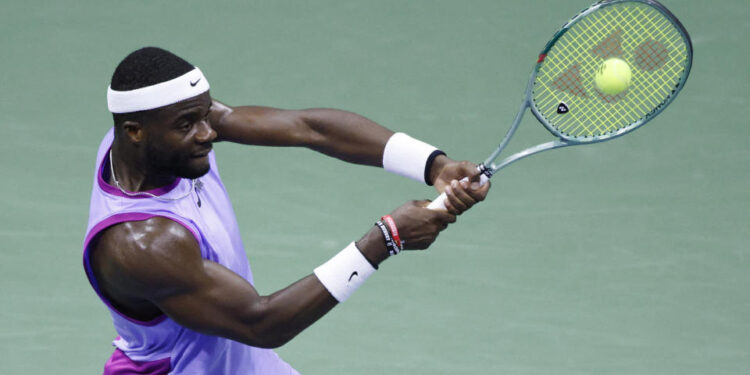 USA's Frances Tiafoe hits a return to Bulgaria's Grigor Dimitrov during their men's quarterfinals match on day nine of the US Open tennis tournament at the USTA Billie Jean King National Tennis Center in New York City, on September 3, 2024. (Photo by Kena Betancur / AFP) (Photo by KENA BETANCUR/AFP via Getty Images)