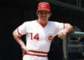 Pete Rose poses on dugout