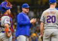 Sep 28, 2024; Milwaukee, Wisconsin, USA; New York Mets manager Carlos Mendoza makes a pitching change in the eighth inning against the Milwaukee Brewers at American Family Field.