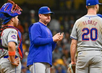 Sep 28, 2024; Milwaukee, Wisconsin, USA; New York Mets manager Carlos Mendoza makes a pitching change in the eighth inning against the Milwaukee Brewers at American Family Field.