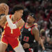 Jalen Johnson #1 of the Atlanta Hawks handles the ball against Torrey Craig #13 of the Chicago Bulls during the second half at the United Center on April 01, 2024 in Chicago, Illinois. NOTE TO USER: User expressly acknowledges and agrees that, by downloading and or using this photograph, User is consenting to the terms and conditions of the Getty Images License Agreement. (Photo by Patrick McDermott/Getty Images)