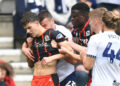 Blackburn Rovers' Owen Beck seems to be bitten on the neck by Preston North End's Milutin Osmajic during a match. (Dave Howarth - CameraSport via Getty Images)