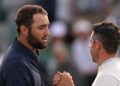 Scottie Scheffler shakes hands with Rory McIlroy