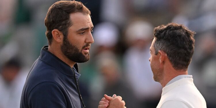 Scottie Scheffler shakes hands with Rory McIlroy