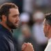 Scottie Scheffler shakes hands with Rory McIlroy