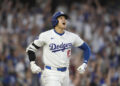 Los Angeles Dodgers' Shohei Ohtani reacts after hitting a three-run home run during the second inning in Game 1 of baseball's NL Division Series against the San Diego Padres, Saturday, Oct. 5, 2024, in Los Angeles. (AP Photo/Mark J. Terrill)