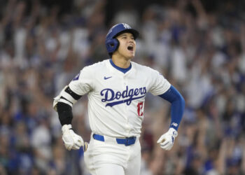 Los Angeles Dodgers' Shohei Ohtani reacts after hitting a three-run home run during the second inning in Game 1 of baseball's NL Division Series against the San Diego Padres, Saturday, Oct. 5, 2024, in Los Angeles. (AP Photo/Mark J. Terrill)