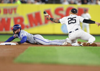 NEW YORK, NEW YORK - OCTOBER 07: Gleyber Torres #25 of the New York Yankees tags out Kyle Isbel #28 of the Kansas City Royals attempting to steal second base in the seventh inning during Game Two of the Division Series at Yankee Stadium on October 07, 2024 in New York City. (Photo by Elsa/Getty Images)