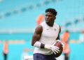 Aug 17, 2024; Miami Gardens, Florida, USA; Miami Dolphins wide receiver Tyreek Hill (10) throws the football before preseason game against the Washington Commanders at Hard Rock Stadium. Mandatory Credit: Sam Navarro-Imagn Images