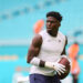 Aug 17, 2024; Miami Gardens, Florida, USA; Miami Dolphins wide receiver Tyreek Hill (10) throws the football before preseason game against the Washington Commanders at Hard Rock Stadium. Mandatory Credit: Sam Navarro-Imagn Images