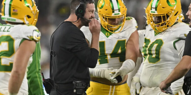 Oregon Ducks head coach Dan Lanning is all smiles during the fourth quarter against the UCLA Bruins at Rose Bowl. Mandatory Credit: Robert Hanashiro-Imagn Images