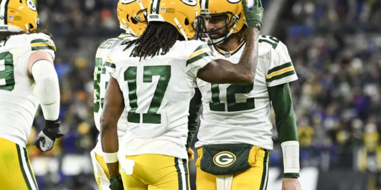 Dec 19, 2021; Baltimore, Maryland, USA; Green Bay Packers wide receiver Davante Adams (17) celebrates with quarterback Aaron Rodgers (12) after scoring a second quarter touchdown against the Baltimore Ravens at M&amp;T Bank Stadium. Mandatory Credit: Tommy Gilligan-Imagn Images