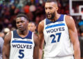 Apr 26, 2024; Phoenix, Arizona, USA; Minnesota Timberwolves guard Anthony Edwards (5) and Minnesota Timberwolves center Rudy Gobert (27) talk during the first half of game three of the first round for the 2024 NBA playoffs against the Phoenix Suns at Footprint Center. credits: Joe Camporeale-USA TODAY Sports