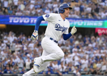 Oct 11, 2024; Los Angeles, California, USA; Los Angeles Dodgers first baseman Freddie Freeman (5) runs after hitting a single in the first inning during game five of the NLDS for the 2024 MLB Playoffs at Dodger Stadium. Mandatory Credit: Jayne Kamin-Oncea-Imagn Images