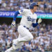 Oct 11, 2024; Los Angeles, California, USA; Los Angeles Dodgers first baseman Freddie Freeman (5) runs after hitting a single in the first inning during game five of the NLDS for the 2024 MLB Playoffs at Dodger Stadium. Mandatory Credit: Jayne Kamin-Oncea-Imagn Images