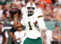 Sep 21, 2024; Tampa, Florida, USA; Miami Hurricanes quarterback Cam Ward (1) drops back to pass against the South Florida Bulls in the second quarter at Raymond James Stadium. Mandatory Credit: Nathan Ray Seebeck-Imagn Images