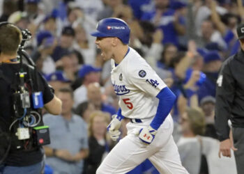 Oct 26, 2024; Los Angeles, California, USA; Los Angeles Dodgers first baseman Freddie Freeman (5) reacts after hitting a solo home run in the third inning against the New York Yankees during game two of the 2024 MLB World Series at Dodger Stadium. Mandatory Credit: Jayne Kamin-Oncea-Imagn Images