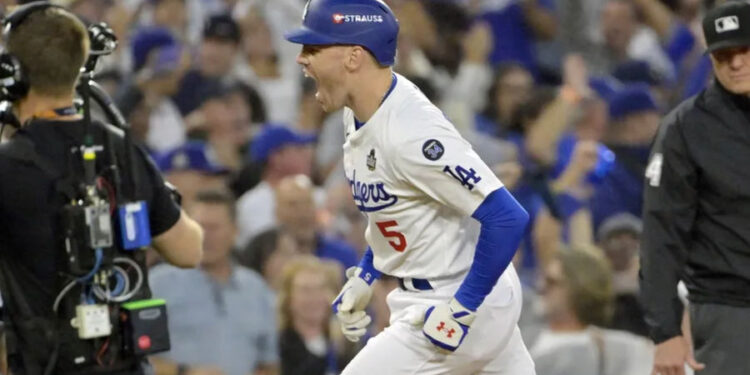 Oct 26, 2024; Los Angeles, California, USA; Los Angeles Dodgers first baseman Freddie Freeman (5) reacts after hitting a solo home run in the third inning against the New York Yankees during game two of the 2024 MLB World Series at Dodger Stadium. Mandatory Credit: Jayne Kamin-Oncea-Imagn Images