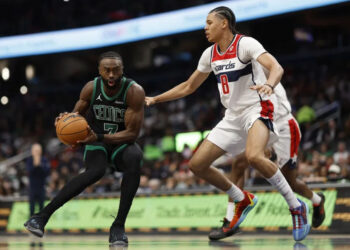 Oct 24, 2024; Washington, District of Columbia, USA; Boston Celtics guard Jaylen Brown (7) drives to the basket as Washington Wizards forward Kyshawn George (18) defends in the first half at Capital One Arena. Mandatory Credit: Geoff Burke-Imagn Images