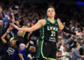 Oct 8, 2024; Minneapolis, Minnesota, USA; Minnesota Lynx guard Kayla McBride (21) celebrates her 3-point basket against the Connecticut Sun during the first half of game five of the 2024 WNBA playoffs at Target Center. Mandatory Credit: Matt Krohn-Imagn Images