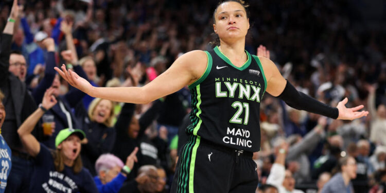 Oct 8, 2024; Minneapolis, Minnesota, USA; Minnesota Lynx guard Kayla McBride (21) celebrates her 3-point basket against the Connecticut Sun during the first half of game five of the 2024 WNBA playoffs at Target Center. Mandatory Credit: Matt Krohn-Imagn Images