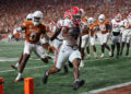 AUSTIN, TX - OCTOBER 19: Georgia Bulldogs running back Trevor Etienne (1) runs runs to the corner of the end zone for a touchdown during the SEC college football game between Texas Longhorns and Georgia Bulldogs on October 19, 2024, at Darrell K Royal - Texas Memorial Stadium in Austin, TX.  (Photo by David Buono/Icon Sportswire via Getty Images)