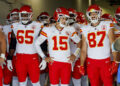 INGLEWOOD, CA - SEPTEMBER 29, 2024: Kansas City Chiefs tight end Travis Kelce (87), right, grins next to Kansas City Chiefs quarterback Patrick Mahomes (15) and Kansas City Chiefs guard Trey Smith (65) before they run onto the field to face the Chargers at the So-Fi Stadium on September 29, 2024 in Inglewood, California. (Gina Ferazzi / Los Angeles Times via Getty Images)